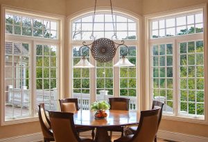  Large arched windows installed in a modern dining room.