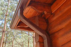 Close-up image of a gutter system attached to the side of a home.